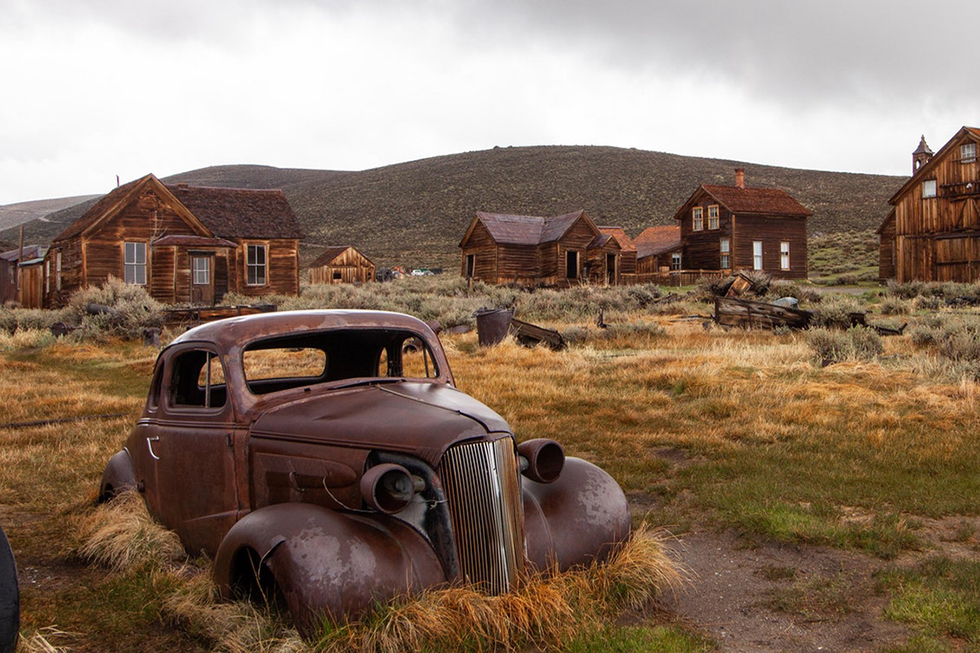 Rusted car in field in Bodie, CA